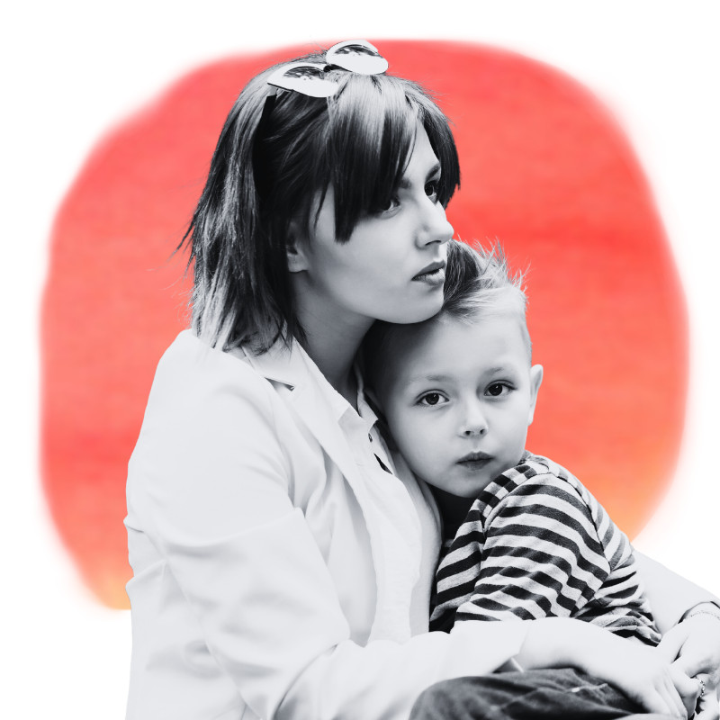 Parent holding young child closely, conveying safety, comfort, and emotional support